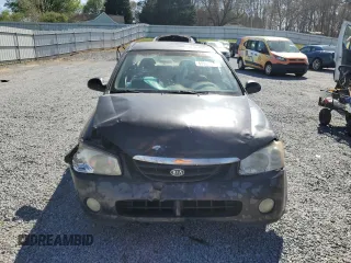 2004 Kia Spectra LX with VIN KNAFE121X45021922, listed as a Copart auction lot 49989845 with 184,189 mi miles and Salvage Title. Bid and sale history available at carsss.com. Image 5.
