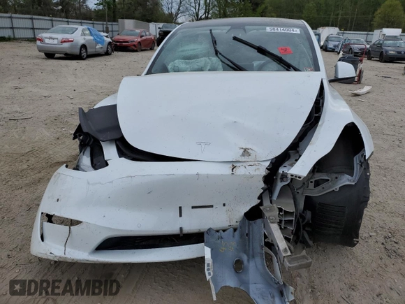 2021 Tesla Model Y Standard Range z VIN 5YJYGDED1MF109091, wystawiony jako Copart lot #50414004 z przebiegiem Nie podano mil oraz Szkody całkowita. Historia ofert i sprzedaży dostępna na DreamBid. Obrazek 5.