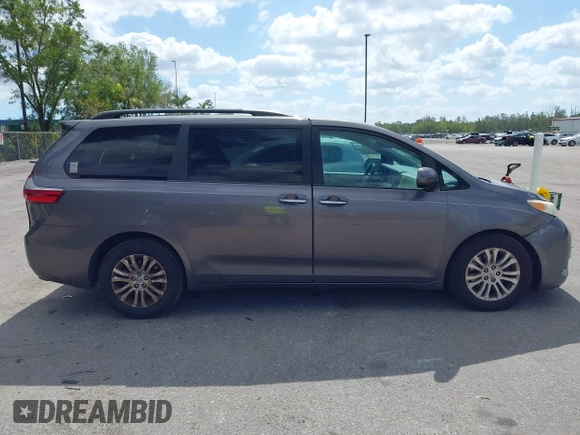 2015 Toyota Sienna XLE with VIN 5TDYK3DC3FS556859, listed as a IAAI auction lot 42161107 with 200,502 mi miles and . Bid and sale history available at DreamBid. Image 13.