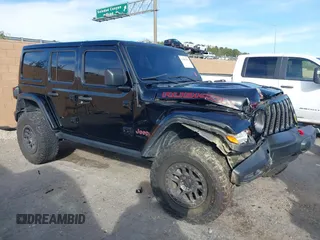2022 Jeep Wrangler Unlimited Rubicon z VIN 1C4JJXFG2NW218539, wystawiony jako IAAI lot #41600699 z przebiegiem 57 762 mil mil oraz . Historia ofert i sprzedaży dostępna na DreamBid. Obrazek 1.