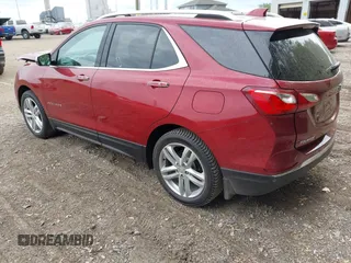 2018 Chevrolet Equinox Premier z VIN 2GNAXMEV3J6329268, wystawiony jako IAAI lot #42240907 z przebiegiem 61 487 mil mil oraz . Historia ofert i sprzedaży dostępna na DreamBid. Obrazek 3.