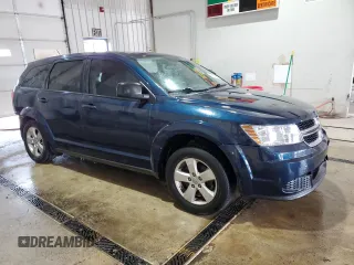 2013 Dodge Journey American Value with VIN 3C4PDCAB4DT581984, listed as a Copart auction lot 59953515 with 166,927 mi miles and Salvage title. Bid and sale history available at DreamBid. Image 4.