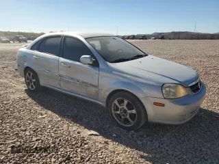 2006 Suzuki Forenza Premium z VIN KL5JJ56Z36K268290, wystawiony jako Copart lot #88509495 z przebiegiem 199 303 mil mil oraz Szkody całkowita. Historia ofert i sprzedaży dostępna na DreamBid. Obrazek 4.