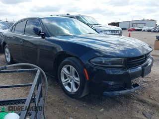 2023 Dodge Charger SXT with VIN 2C3CDXBG2PH550671, listed as a IAAI auction lot 42123200 with 50,818 mi miles. Bid and sale history available at carsss.com. Image 1.
