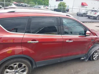 2015 Ford Escape Titanium z VIN 1FMCU0J99FUA92432, wystawiony jako IAAI lot #42257036 z przebiegiem 127 632 mil mil oraz . Historia ofert i sprzedaży dostępna na DreamBid. Obrazek 13.