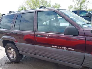 1997 Jeep Grand Cherokee Laredo with VIN 1J4GZ58S4VC702040, listed as a IAAI auction lot 42165536 with 121,803 mi miles and . Bid and sale history available at DreamBid. Image 14.