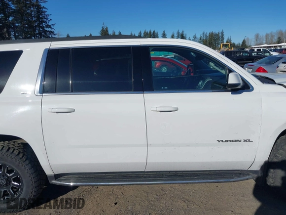 2019 GMC Yukon XL SLE z VIN 1GKS2FKC9KR147823, wystawiony jako IAAI lot #41571738 z przebiegiem 95 764 mil mil oraz . Historia ofert i sprzedaży dostępna na DreamBid. Obrazek 13.