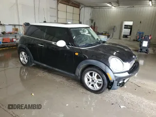 2011 MINI Hardtop with VIN WMWSU3C59BT099759, listed as a Copart auction lot 53995355 with 141,575 mi miles and Salvage Title. Bid and sale history available at DreamBid. Image 4.