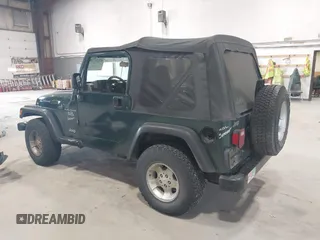 2000 Jeep Wrangler Sport with VIN 1J4FA49S2YP712526, listed as a IAAI auction lot 42151725 with 99,416 mi miles. Bid and sale history available at carsss.com. Image 3.