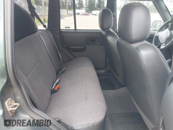 1999 Jeep Cherokee Sport with VIN 1J4FF68S5XL677243, listed as a IAAI auction lot 42221329 with 293,808 mi miles and . Bid and sale history available at DreamBid. Image 8.
