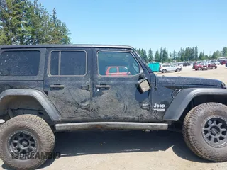 2018 Jeep Wrangler Unlimited Sport S with VIN 1C4HJXDN1JW216825, listed as a IAAI auction lot 42405799 with 37,194 mi miles and . Bid and sale history available at DreamBid. Image 13.