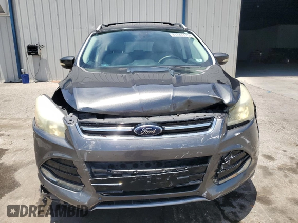 2015 Ford Escape Titanium z VIN 1FMCU0J98FUB06577, wystawiony jako Copart lot #61341175 z przebiegiem 66 206 mil mil oraz Szkoda całkowita • Salvage title. Historia ofert i sprzedaży dostępna na DreamBid. Obrazek 5.