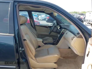 1997 Mercedes-Benz E-Class with VIN WDBJF55F7VJ027080, listed as a IAAI auction lot 42120838 with 150,197 mi miles. Bid and sale history available at carsss.com. Image 5.