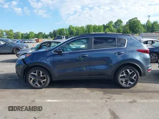 2021 Kia Sportage EX z VIN KNDPNCAC4M7897590, wystawiony jako IAAI lot #42183678 z przebiegiem 110 657 mil mil oraz . Historia ofert i sprzedaży dostępna na DreamBid. Obrazek 14.
