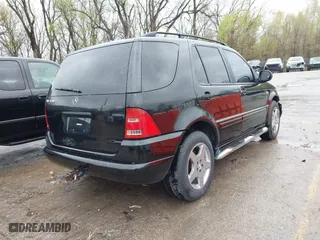 2001 Mercedes-Benz M-Class with VIN 4JGAB72E41A275216, listed as a IAAI auction lot 41953087 with 243,589 mi miles. Bid and sale history available at carsss.com. Image 4.