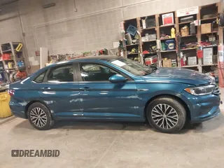 2019 Volkswagen Jetta SEL z VIN 3VWE57BU2KM116717, wystawiony jako IAAI lot #41951428 z przebiegiem 85 791 mil mil oraz . Historia ofert i sprzedaży dostępna na DreamBid. Obrazek 13.