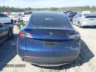 2025 Tesla Model Y Long Range with VIN 7SAYGDEEXSA346006, listed as a IAAI auction lot 41835610 with 1,896 mi miles and . Bid and sale history available at carsss.com. Image 16.