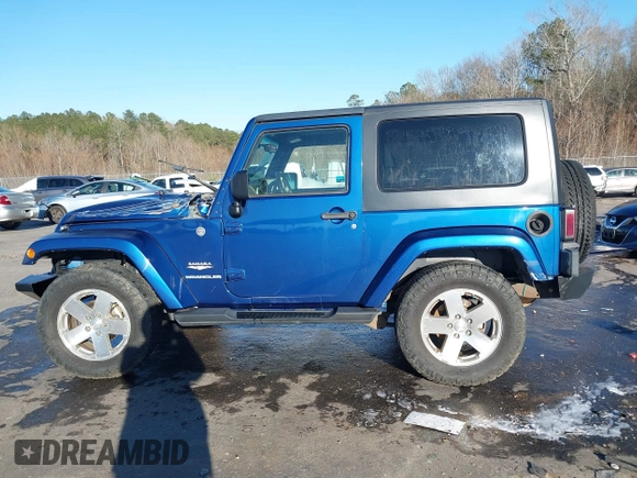 2009 Jeep Wrangler Sahara z VIN 1J4FA54199L722192, wystawiony jako IAAI lot #41619305 z przebiegiem 105 545 mil mil oraz . Historia ofert i sprzedaży dostępna na DreamBid. Obrazek 14.