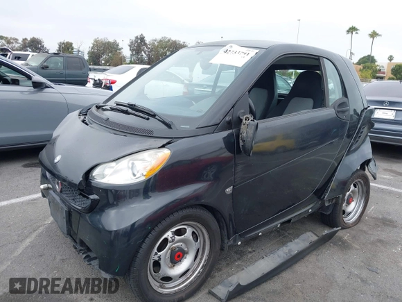 2013 Smart fortwo Pure with VIN WMEEJ3BA1DK651627, listed as a IAAI auction lot 42733791 with 130,561 mi miles and . Bid and sale history available at DreamBid. Image 2.