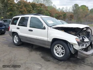 2003 Jeep Grand Cherokee Laredo with VIN 1J4GW48S33C521253, listed as a IAAI auction lot 41929756 with 209,686 mi miles. Bid and sale history available at carsss.com. Image 13.