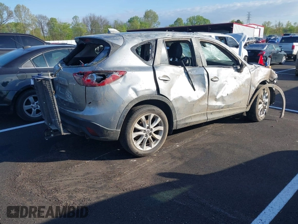 2013 Mazda CX-5 Grand Touring with VIN JM3KE2DEXD0130585, listed as a IAAI auction lot 42001388 with 66,348 mi miles. Bid and sale history available at carsss.com. Image 4.
