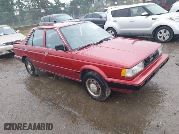 1990 Nissan Sentra z VIN JN1GB21B5LU503902, wystawiony jako IAAI lot #42358723 z przebiegiem 172 484 mil mil oraz . Historia ofert i sprzedaży dostępna na DreamBid. Obrazek 1.