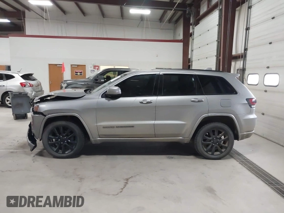 2018 Jeep Grand Cherokee Laredo E with VIN 1C4RJFAG6JC102969, listed as a IAAI auction lot 41963137 with 112,361 mi miles and . Bid and sale history available at DreamBid. Image 14.