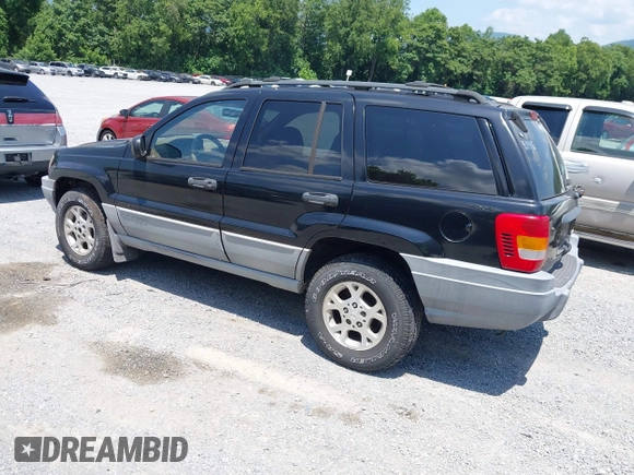 2000 Jeep Grand Cherokee Laredo with VIN 1J4GW48N7YC357376, listed as a IAAI auction lot 42503429 with 211,154 mi miles and . Bid and sale history available at DreamBid. Image 3.