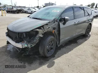 2023 Chrysler Pacifica Hybrid Touring L with VIN 2C4RC1L75PR580133, listed as a Copart auction lot 56873655 with 31,718 mi miles and Salvage title. Bid and sale history available at DreamBid. Image 1.