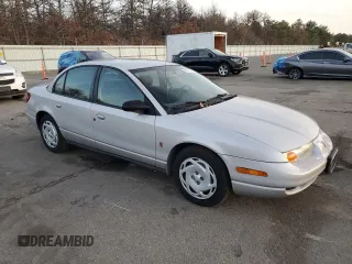 2001 Saturn SL z VIN 1G8ZK52761Z204012, wystawiony jako Copart lot #86618384 z przebiegiem 99 674 mil mil oraz Szkoda całkowita • Salvage title. Historia ofert i sprzedaży dostępna na DreamBid. Obrazek 4.