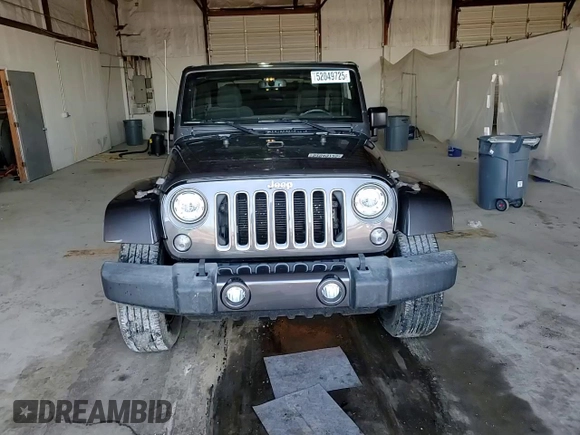 2017 Jeep Wrangler Sahara z VIN 1C4AJWBG6HL582839, wystawiony jako Copart lot #52049725 z przebiegiem 143 544 mil mil oraz Szkoda całkowita • Salvage title. Historia ofert i sprzedaży dostępna na DreamBid. Obrazek 11.