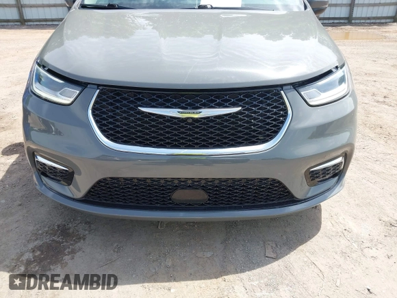 2023 Chrysler Pacifica Hybrid Touring L with VIN 2C4RC1L73PR522988, listed as a IAAI auction lot 42280263 with 54,939 mi miles and . Bid and sale history available at DreamBid. Image 12.