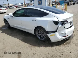 2022 Tesla Model 3 Long Range z VIN 5YJ3E1EB3NF174314, wystawiony jako Copart lot #52713325 z przebiegiem 27 646 mil mil oraz Szkoda całkowita • Salvage title. Historia ofert i sprzedaży dostępna na DreamBid. Obrazek 2.