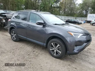 2018 Toyota RAV4 XLE with VIN 2T3WFREV6JW409330, listed as a Copart auction lot 51284165 with 83,689 mi miles and Salvage Title. Bid and sale history available at DreamBid. Image 4.