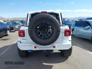 2021 Jeep Wrangler Unlimited Sahara with VIN 1C4JJXP63MW716690, listed as a IAAI auction lot 42087879 with 40,889 mi miles and . Bid and sale history available at DreamBid. Image 16.