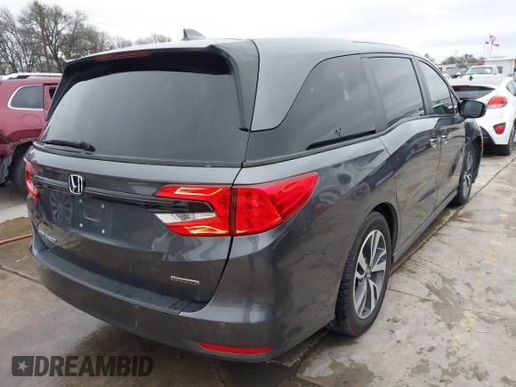 2021 Honda Odyssey Touring with VIN 5FNRL6H86MB021504, listed as a IAAI auction lot 41550040 with 55,068 mi miles. Bid and sale history available at carsss.com. Image 4.