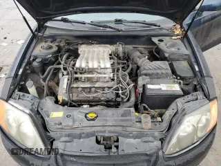 2003 Hyundai Tiburon GT z VIN KMHHN65F13U068658, wystawiony jako Copart lot #81799404 z przebiegiem 163 148 mil mil oraz Szkoda całkowita • Salvage title. Historia ofert i sprzedaży dostępna na DreamBid. Obrazek 11.