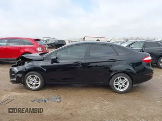 2019 Ford Fiesta SE z VIN 3FADP4BJ7KM158142, wystawiony jako IAAI lot #41510806 z przebiegiem 55 315 mil mil oraz . Historia ofert i sprzedaży dostępna na DreamBid. Obrazek 14.