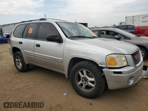 2005 GMC Envoy SLT with VIN 1GKDT13S152124404, listed as a Copart auction lot 64011494 with 212,951 mi miles and Salvage Title. Bid and sale history available at DreamBid. Image 4.
