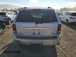 2009 Jeep Grand Cherokee Laredo with VIN 1J8HR48P39C559192, listed as a Copart auction lot 74007094 with 105,997 mi miles and Salvage Title. Bid and sale history available at carsss.com. Image 6.