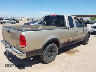 1999 Ford F-150 XL z VIN 1FTRX17L7XNB93799, wystawiony jako IAAI lot #42235164 z przebiegiem 299 846 mil mil oraz . Historia ofert i sprzedaży dostępna na DreamBid. Obrazek 4.