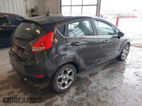 2011 Ford Fiesta SES with VIN 3FADP4FJ7BM196559, listed as a IAAI auction lot 41527976 with 65,861 mi miles. Bid and sale history available at carsss.com. Image 4.