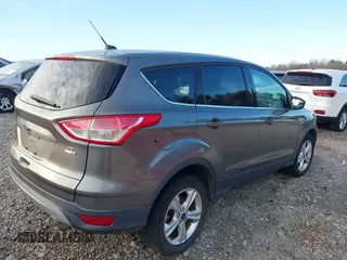 2014 Ford Escape SE with VIN 1FMCU9GX7EUD84797, listed as a IAAI auction lot 41430559 with 157,533 mi miles. Bid and sale history available at carsss.com. Image 4.
