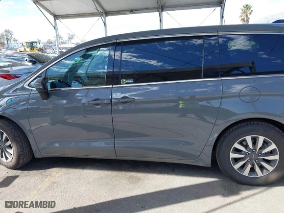 2023 Chrysler Pacifica Hybrid Touring L with VIN 2C4RC1L73PR509853, listed as a IAAI auction lot 41690872 with 83,014 mi miles. Bid and sale history available at carsss.com. Image 15.