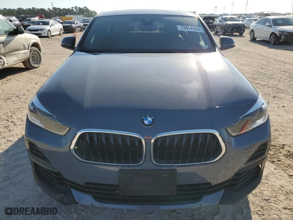 2021 BMW X2 xDrive28i with VIN WBXYJ1C04M5S07696, listed as a Copart auction lot 73412384 with 35,004 mi miles and Salvage Title. Bid and sale history available at carsss.com. Image 5.