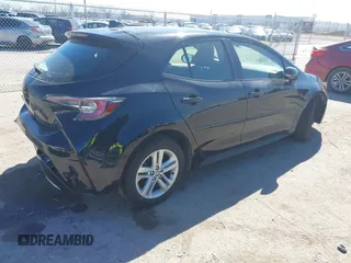 2021 Toyota Corolla SE with VIN JTND4MBE3M3144552, listed as a IAAI auction lot 41699317 with 57,309 mi miles and . Bid and sale history available at DreamBid. Image 4.