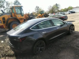 2020 Tesla Model 3 Standard Range Plus with VIN 5YJ3E1EA7LF598910, listed as a IAAI auction lot 42030288 with 95,811 mi miles. Bid and sale history available at carsss.com. Image 4.