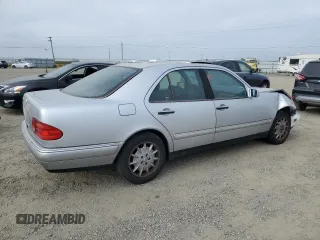 1999 Mercedes-Benz E-Class with VIN WDBJF65H0XA797390, listed as a Copart auction lot 55081405 with 80,950 mi miles and Salvage Title. Bid and sale history available at carsss.com. Image 3.