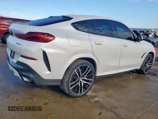 2023 BMW X6 xDrive40i z VIN 5UXCY6C08P9N43749, wystawiony jako Copart lot #54092795 z przebiegiem 39 495 mil mil oraz Szkody całkowita. Historia ofert i sprzedaży dostępna na DreamBid. Obrazek 3.