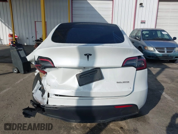2023 Tesla Model Y Long Range with VIN 7SAYGAEE7PF766735, listed as a IAAI auction lot 41626651 with 21,983 mi miles. Bid and sale history available at carsss.com. Image 17.